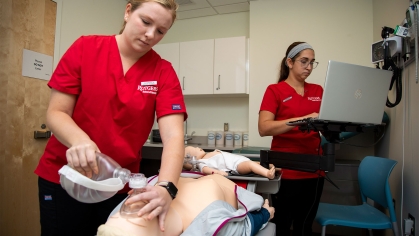 Student nurse applying CPR