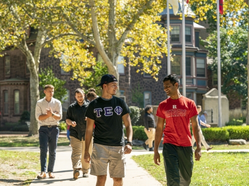 students walking along campus