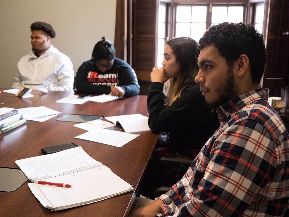 students at conference table