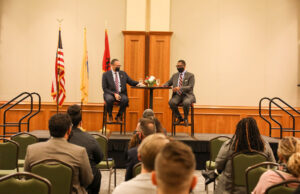 Rutgers President Jonathan Holloway (left) was introduced by Rutgers University–Camden Chancellor Antonio D. Tillis (right) during the town hall.