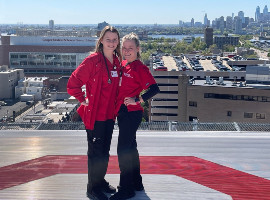 Rachel and Kelly Murphy on the helipad of Cooper University Hospital.