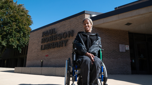 Student in Wheelchair outside the Paul Robeson Library