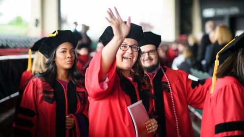 Law Commencement Student Waving