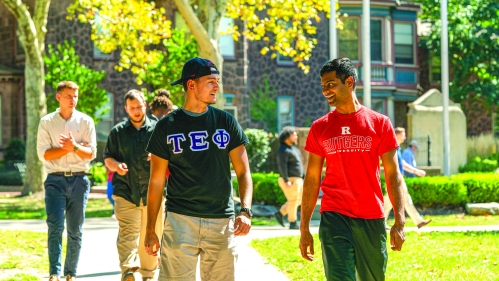 Students walking across the Rutgers University–Camden campus