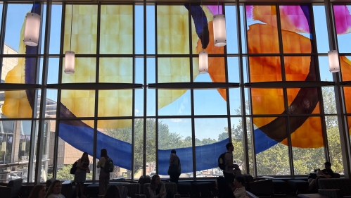 Figures Shilouetted on Window at Rutgers-Camden Law Bridge