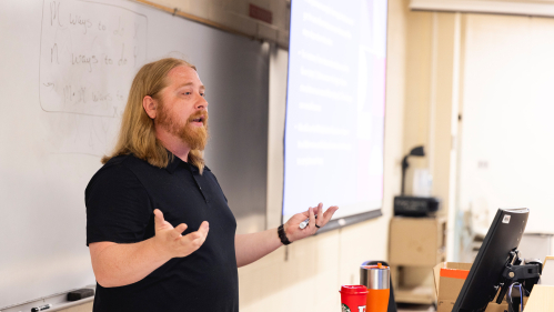 Mathematics professor in front of white board