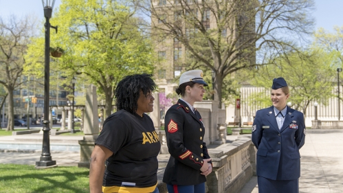 veteran military students talking outside