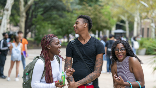 students laughing and having fun on the quad