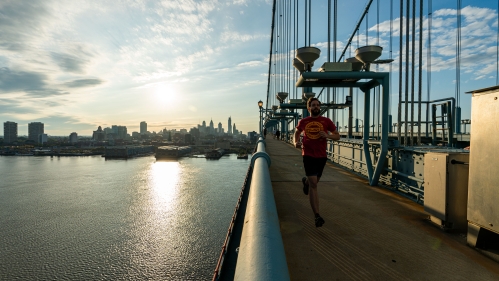 Student Running on the Benjamin Franklin Bridge