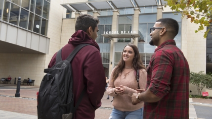 law students holding a discussion outdoors