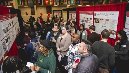 Crowd of students attending CURCA research event.
