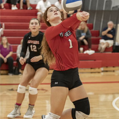Scarlet Raptor Vollyball Player spiking ball