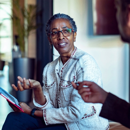 elderly woman in meeting