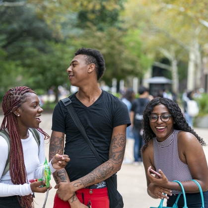 students laughing and having fun on the quad