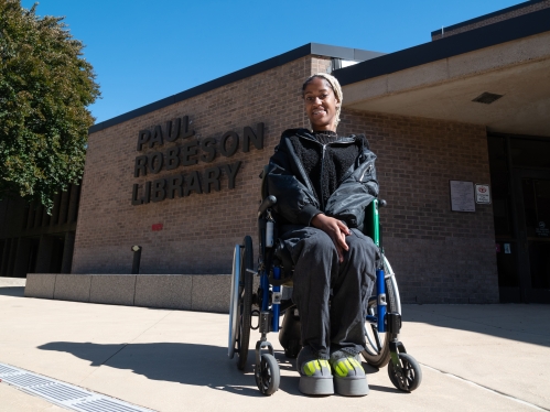 Student in Wheelchair outside the Paul Robeson Library