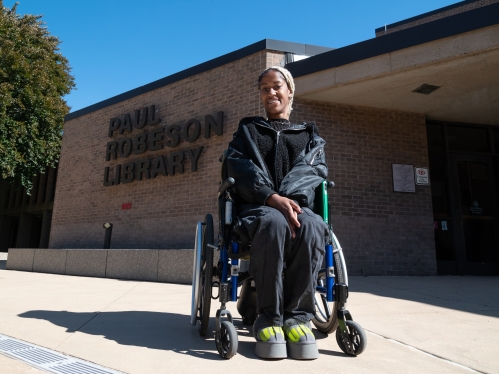 Student in Wheelchair outside the Paul Robeson Library