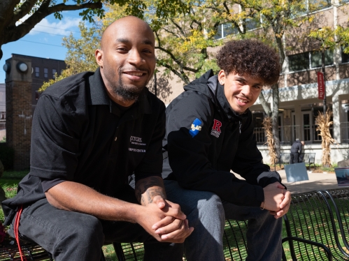 two male students smiling