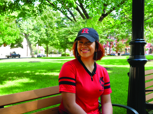 Educational Opportunity Fund Program (EOF) student sitting on bench in the campus quad
