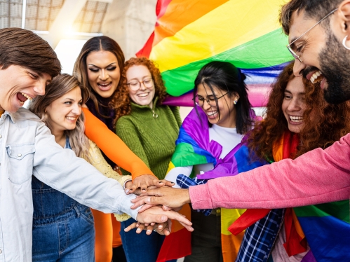 LGBTQ community with multiracial friends celebrating gay pride festival