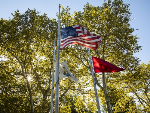 American and Rutgers flags flowing in distance