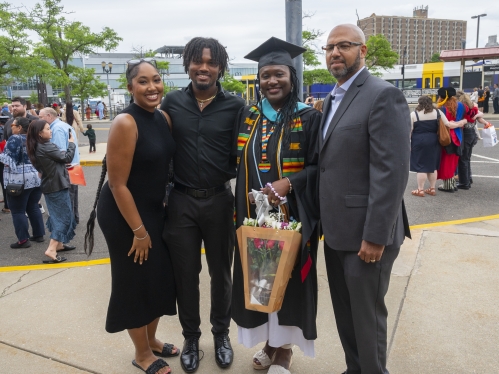 Commencement 2024 graduate taking photo with family