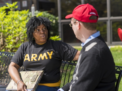 veteran military students talking outside the Campus Center