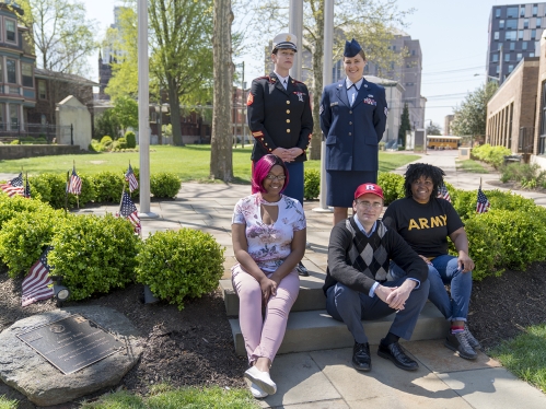 veteran military students surrounding memorial on Rutgers Camden campus