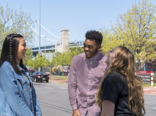 group of students laughing outside 