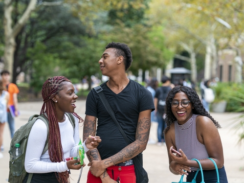 students laughing and having fun on the quad