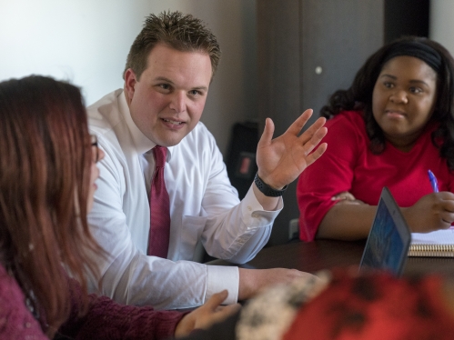 professor and students at table