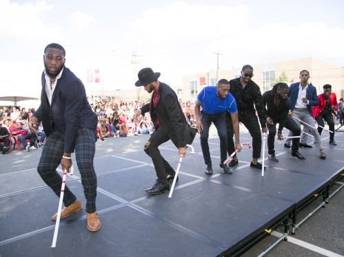men dancing with canes