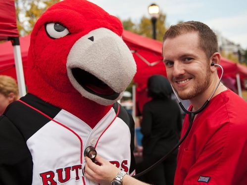 Nursing Student with Scarlet Raptor Mascot