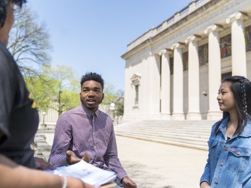 students holding discussion