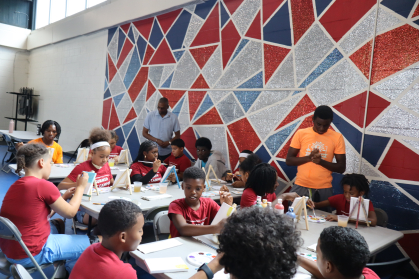 Children participate in an art class.
