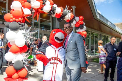 Chancellor Tillis with the Scarlet Raptor Mascot