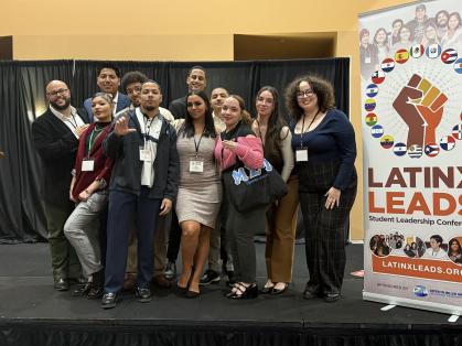 Colon representing Rutgers-Camden at a student conference in New Orleans, Louisiana.