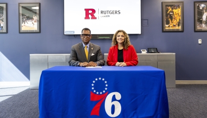 Chancellor Antonio D. Tillis and Magda Moncrief, vice president of human resources for the Philadelphia 76ers
