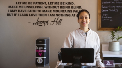 Brennah Lambert behind the counter at LesbiVeggies