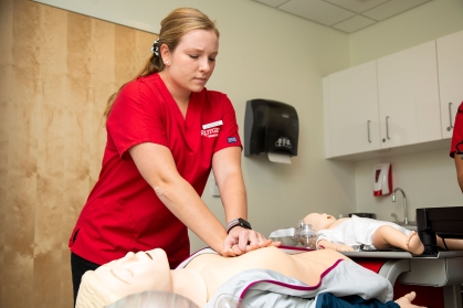 A nursing student practices CPR