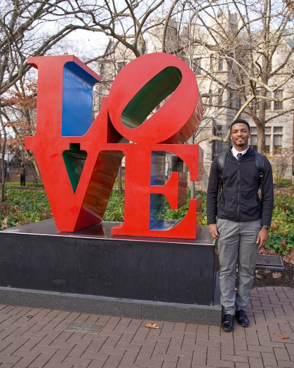 Gavin Henry CCAS’24 by the "LOVE" statue