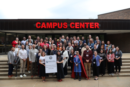 The attendees of the Gilman Advisors Workshop gather on the steps of the Rutgers-Camden Campus Center.