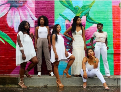 women standing next to each other in solidarity