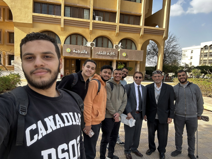 Professors and students pose outside at Al-Azhar University