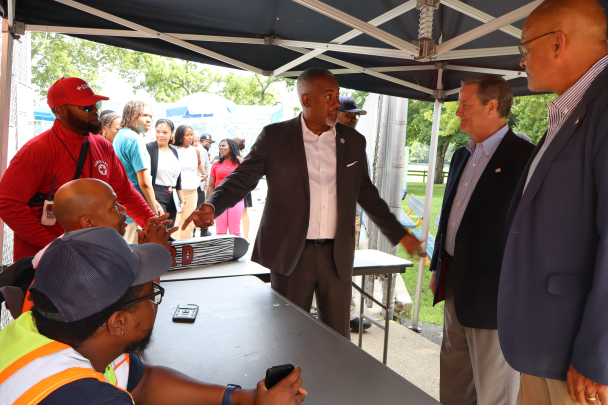 Leaders talk to staff members of the community center.