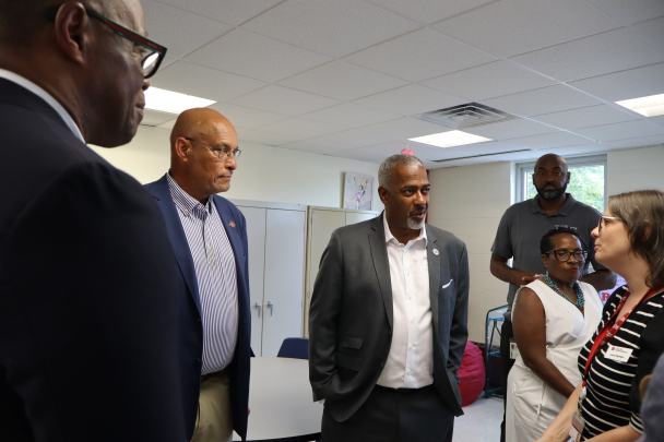 Leaders listening to programming available at the community center.