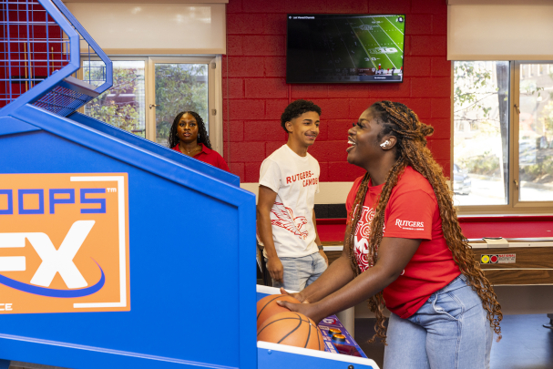 Students in Housing Complex enjoy a basketball game inside the residence hall