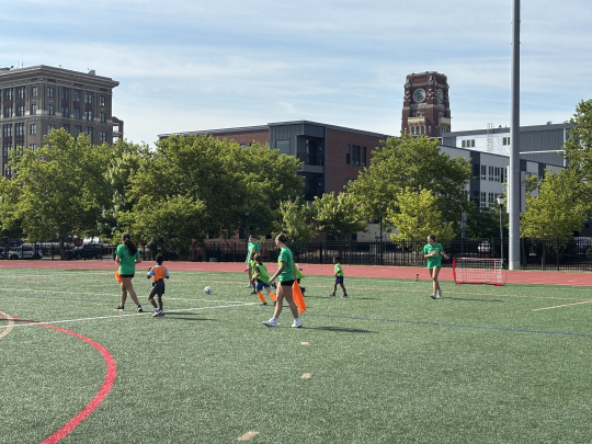 Players and kids run drills at SoccerFest26.