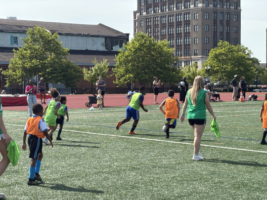 Kids playing on the field at SoccerFest26.