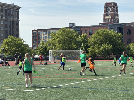 Local Children play soccer with Rutgers-Camden students at SoccerFest26.