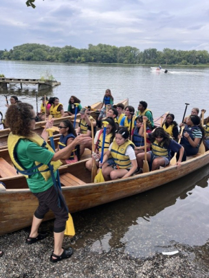 Honors College Impact Day Boat Trip: Students in canoes about to launch into water